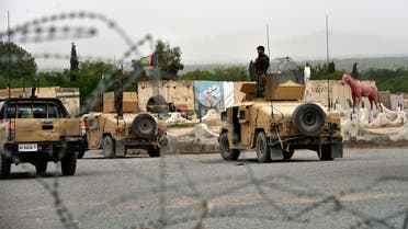 Afghan security forces stand on Humvee vehicles during a military operation in Kandahar province, April 4, 2021. (Reuters)