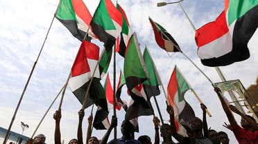 People wave national flags as they demonstrate against the killing of protesting children, who were shot dead when security forces broke up a student protest in Khartoum, Sudan August 1, 2019. (Reuters)