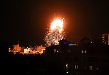 Smoke and flames rise above a building during Israeli air strikes, amid a flare-up of Israeli-Palestinian fighting, in Gaza City May 17, 2021. (Reuters)