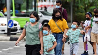 Singapore to close schools, warns new COVID-19 strains infecting children