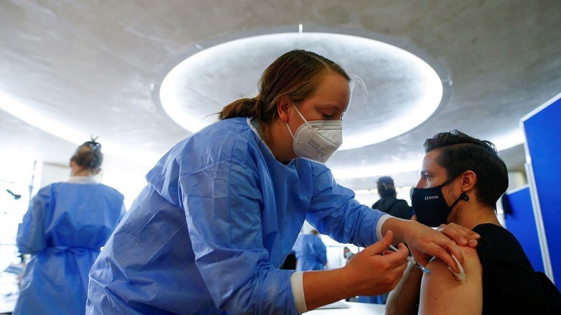 A man receives a dose of the AstraZeneca COVID-19 vaccine in the Central Mosque in Ehrenfeld suburb, amid the coronavirus disease (COVID-19) pandemic, in Cologne, Germany, May 8, 2021. (Reuters)