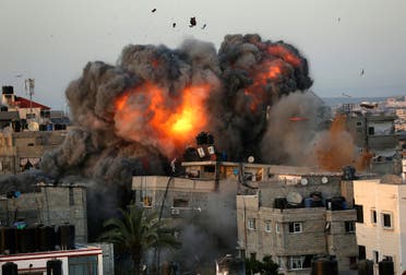 A ball of fire erupts from a building in Gaza City's Rimal residential district on May 16, 2021, during massive Israeli bombardment on the Hamas-controlled enclave. (AFP)