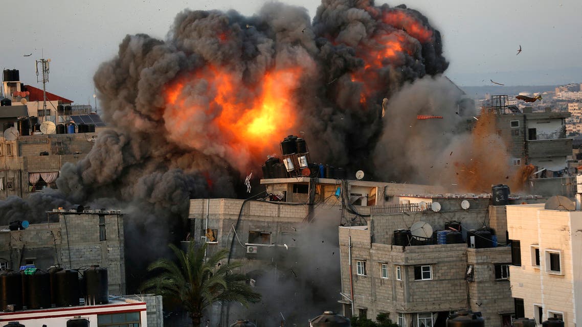 A ball of fire erupts from a building in Gaza City's Rimal residential district on May 16, 2021, during massive Israeli bombardment on the Hamas-controlled enclave.