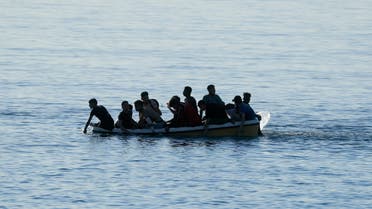 Moroccan citizens arrive on a boat at El Tarajal beach, near the fence between the Spanish-Moroccan border, after thousands of migrants swam across the border on Monday, in Ceuta, Spain, May 19, 2021. (File photo: Reuters)