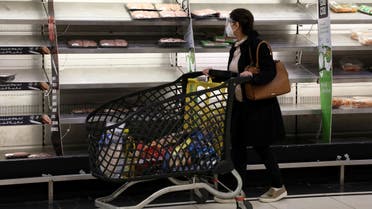 A shopper walks past near-empty shelves at a supermarket in Beirut, Lebanon March 16, 2021. Picture taken March 16, 2021. (Reuters)
