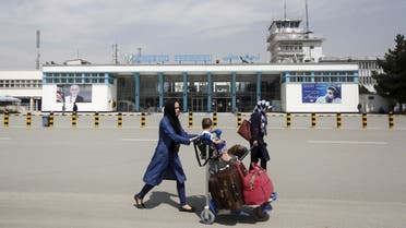 Afghan passengers walk in front of Hamid Karzai International Airport in Kabul, Afghanistan. (File photo: Reuters)
