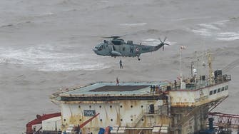 Indian navy searches for 78 missing from barge sunk by storm