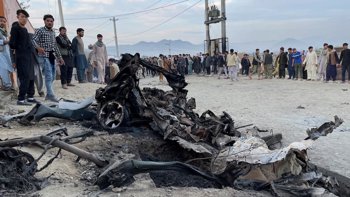 People stand at the site of a blast in Kabul, Afghanistan May 8, 2021. REUTERS/Stringer NO RESALES. NO ARCHIVES