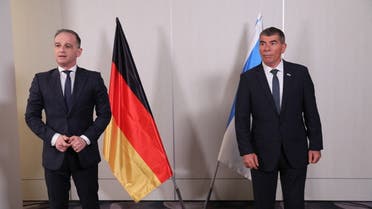 Israeli Foreign Minister Gabi Ashkenazi (R) and his German counterpart Heiko Maas (L) are pictured during a meeting at Ben Gurion Airport near Tel Aviv on May 20. (AFP)