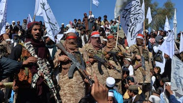 Afghan Taliban militants and villagers attend a gathering as they celebrate the peace deal and their victory in the Afghan conflict on US in Afghanistan, in Alingar district of Laghman Province on March 2, 2020. The Taliban said on March 2 they were resuming offensive operations against Afghan security forces, ending the partial truce that preceded the signing of a deal between the insurgents and Washington.