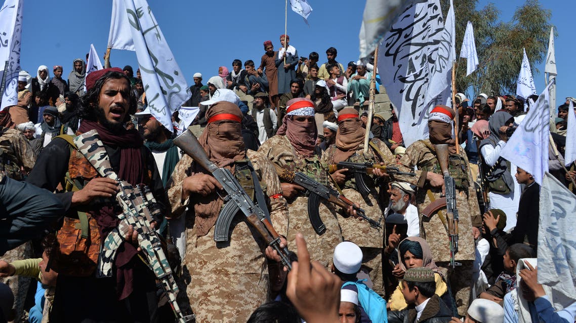 Afghan Taliban militants and villagers attend a gathering as they celebrate the peace deal and their victory in the Afghan conflict in Afghanistan, in Alingar district of Laghman Province on March 2, 2020. (AFP)