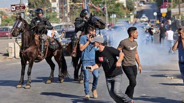 Israeli security forces on horseback disperse Palestinian demonstrators during protests against Israel's occupation and its air campaign on the Gaza strip, at the flashpoint Sheikh Jarrah neighbourhood in east Jerusalem, on May 18, 2021. The UN Security Council was to hold an emergency meeting amid a diplomatic push to end the devastating conflict between Israel and Gaza's armed groups that has killed more than 220 people, most of them Palestinians.
