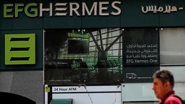 An Egyptian man walks past a branch of the EFG Hermes investment bank in Cairo, Egypt. (File photo: Reuters)
