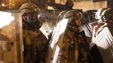 Members of the Lebanese army are deployed during a protest against the lockdown and worsening economic conditions, amid the spread of the coronavirus disease in Tripoli, Jan. 29, 2021. (Reuters)