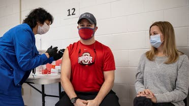 Jake Lawler, 29, receives his coronavirus disease (COVID-19) vaccine as vaccine eligibility expands to anyone over the age of 16 at the Bradfield Community Center through Health Partners of Western Ohio in Lima, Ohio. (Reuters)