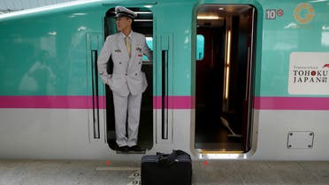 A Shinkansen driver looks on as the Tohoku Line train prepares to depart Tokyo station in Japan September 29, 2019. Picture taken September 29, 2019. REUTERS/Edgar Su