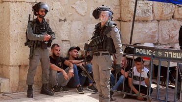 Israeli security forces are pictured at the entrance of Jerusalem's al-Aqsa mosque compound, on May 21, 2021 after fresh clashes between Palestinians and Israeli police broke out. (AFP)