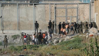 Hundreds of migrants storm border separating Spain’s Melilla enclave from Morocco