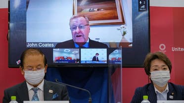 CEO of the Tokyo 2020 Toshiro Muto, left, and President of the Tokyo 2020 Seiko Hashimoto, right, listen to Chairman of the Coordination Commission for the Games of the XXXII Olympiad Tokyo 2020 John Coates, (on screen), delivering a speech during the Tokyo 2020 IOC Coordination Commission press conference on May 21, 2021 in Tokyo. (AP)