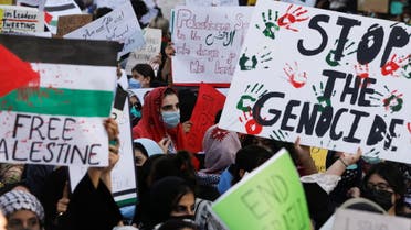 Students carry signs as they chant slogans to express solidarity with Palestinian people, during a protest organized by the Students Action Committee in Karachi, Pakistan May 19, 2021. REUTERS/Akhtar Soomro
