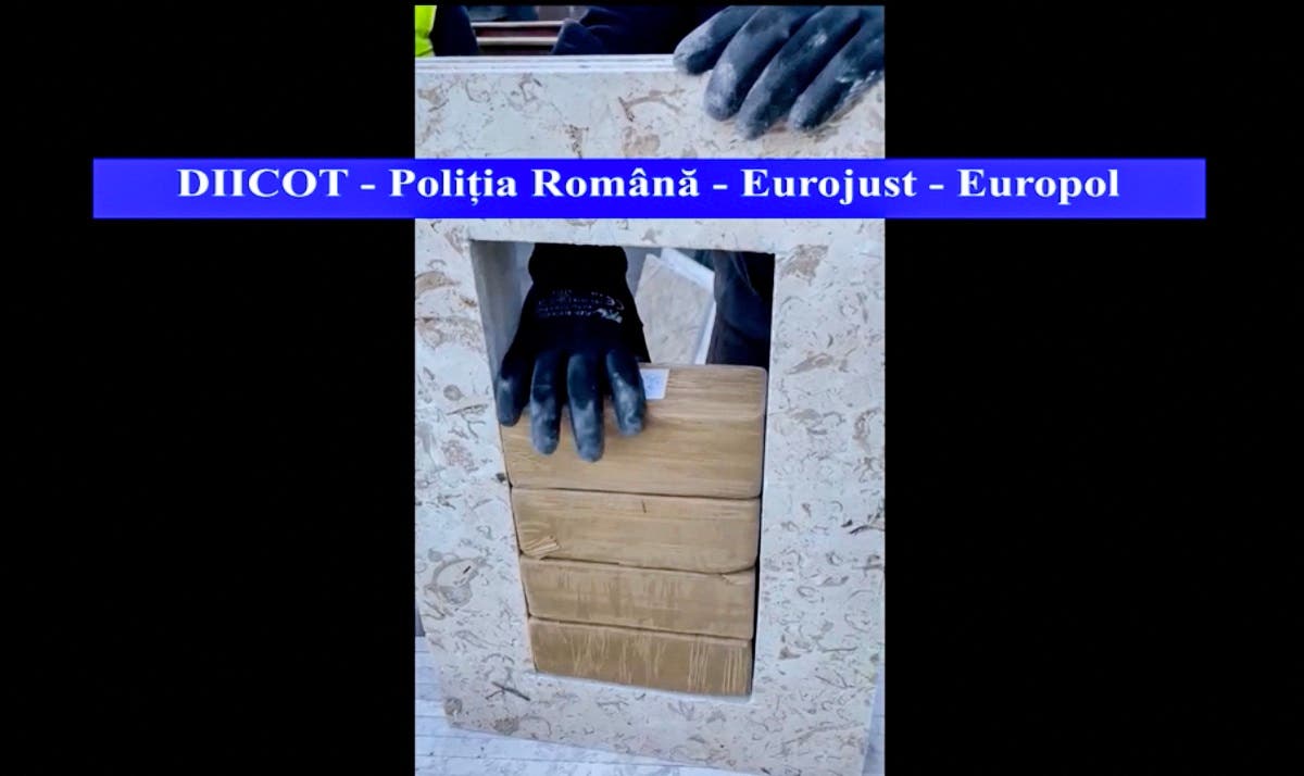 A video grab of footage made available by the Romanian anti-mafia prosecution (DIICOT) taken in Constanta commercial harbour on May 20, 2021 shows a container loaded with stone tiles. The Romanian prosecution announced that it had discovered in the port of Constanta (south-east) nearly a ton and a half of heroin from Iran, one of the largest seizures made in recent years in a country of the 'European Union. Eurojust. (DIICOT / Directorate for the Investigation of Organized Crime (DIICOT)/AFP)