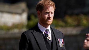 Britain's Prince Harry walking in the procession at Windsor Castle, Berkshire, during the funeral of Britain's Prince Philip, who died at the age of 99, Britain, April 17, 2021.  (Reuters)
