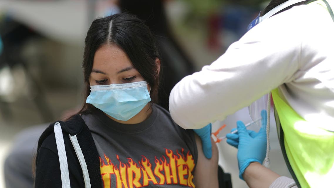 Sandra Cervantes, 14, receives a COVID-19 vaccination in Pasadena, California, May 14, 2021. (Reuters)