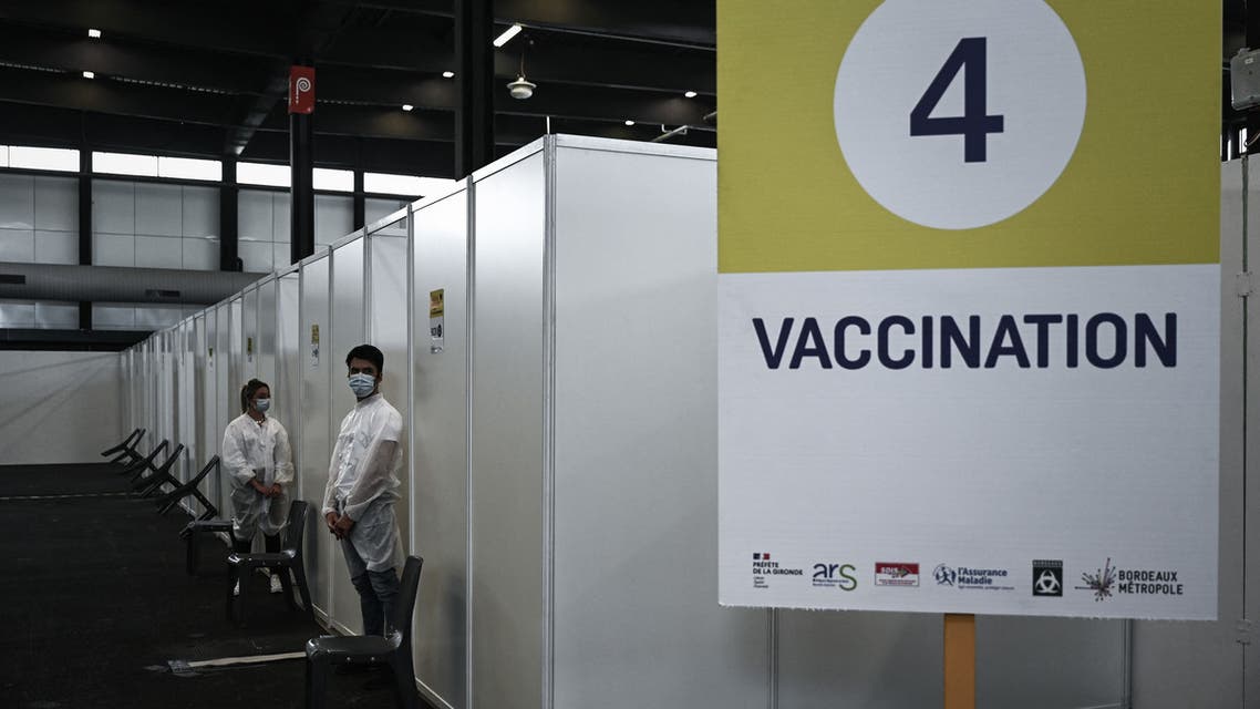 Medical personnel wait at the new vaccination center using the Pfizer-BioNTech vaccine against the coronavirus at the Parc des Expositions in Bordeaux, southwestern France, on April 8, 2021, during a vaccination campaign to fight the COVID-19 pandemic. (AFP)