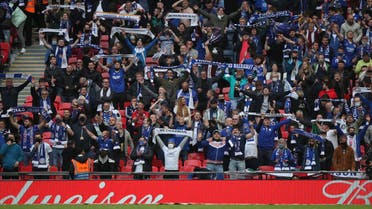 Leicester supporters cheer on their team during the English FA Cup final football match between Chelsea and Leicester City at Wembley Stadium in north west London on May 15, 2021.