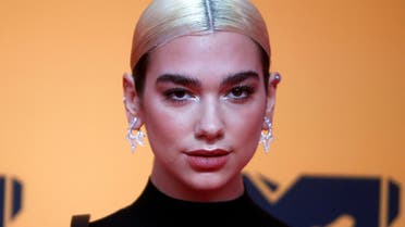 Dua Lipa poses on a red carpet as she arrives at the 2019 MTV Europe Music Awards at the FIBES Conference and Exhibition Centre in Seville, Spain. (Reuters)