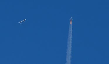 The SpaceShipTwo VSS Unity passenger craft (R) is seen after separation from Virgin Galactic rocket plane, the WhiteKnightTwo carrier airplane (L), upon taking off from Mojave Air and Space Port in Mojave, California, US, February 22, 2019. (Reuters)