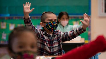 Kindergarten students participate in a classroom activity on the first day of in-person learning at Maurice Sendak Elementary School in Los Angeles, April 13, 2021. (AP)