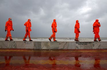 Members of the National Disaster Response Force (NDRF) patrol along a shore ahead of Cyclone Yaas in Digha in Purba Medinipur district in the eastern state of West Bengal, India, May 25, 2021. (Reuters)