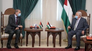 A handout picture provided by the Palestinian Authority's press office (PPO) shows Palestinian president Mahmud Abbas (R) meeting with Jordanian Foreign Minister Ayman Safadi in Ramallah in the occupied West Bank on May 25, 2021.