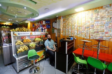Ahmed, a 40-year old Syrian man from Damascus, selling fruit juice is pictured at his shop in Istanbul, Turkey May 24, 2021. (Reuters)