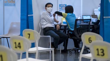 A man receives a dose of China's Sinovac COVID-19 coronavirus vaccine at a community vaccination centre in Hong Kong on February 23, 2021.