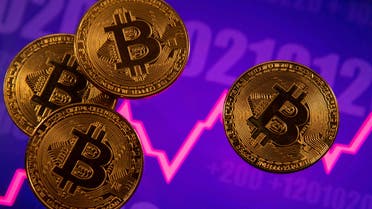 FILE PHOTO: A representation of virtual currency Bitcoin is seen in front of a stock graph in this illustration taken March 15, 2021. (File Photo: Reuters)