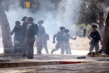 Israeli security forces clash with Palestinians at the compound that houses Al-Aqsa Mosque, known to Muslims as Noble Sanctuary and to Jews as Temple Mount, in Jerusalem's Old City May 21, 2021. (Reuters/Ammar Awad)