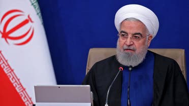 A handout picture provided by the Iranian presidency on April 28, 2021, shows Iran's President Hassan Rouhani attending a cabinet meeting in the capital Tehran. Iran's foreign minister said he favours a smart adjustment between the military and diplomatic spheres, in his first public reaction to leaked audio of him bemoaning the military's influence. Mohammad Javad Zarif also said he regretted that the leak had triggered domestic infighting, amid a furious reaction from conservative figures and media outlets.