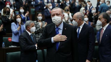 Turkey’s President Erdogan greets members of his ruling AK Party during a meeting at the parliament in Ankara, Turkey May 26, 2021. (Murat Cetinmuhurdar/Presidential Press Office/Handout via Reuters)