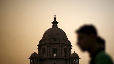 A commuter walks past the building of India's Ministry of Finance during dusk in New Delhi, India, May 18, 2015. India's Finance Ministry could have sidestepped a damaging multibillion-dollar tax row with foreign investors if it had acted on regular warning letters that officials had been sending since as long ago as September. (Reuters)