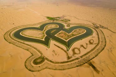 A picture taken with a drone on July 31, 2019, shows the new man-made Love lake at al-Qudra desert in the Gulf emirate of Dubai. (AFP)