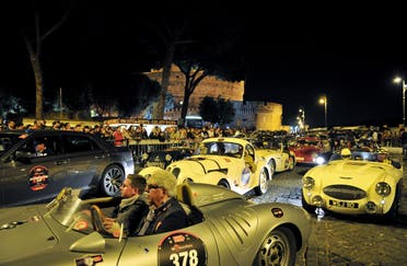 Vintage cars pass by Castel Sant'Angelo during Mille Miglia race arrival in Rome on May 18, 2012. This historic parade of classic machines called Mille miglia started in 1927 from Brescia to Rome and back. (File photo: AFP)