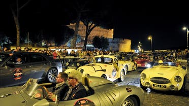 Vintage cars pass by Castel Sant'Angelo during Mille Miglia race arrival in Rome on May 18, 2012. This historic parade of classic machines called Mille miglia started in 1927 from Brescia to Rome and back. (File photo: AFP)