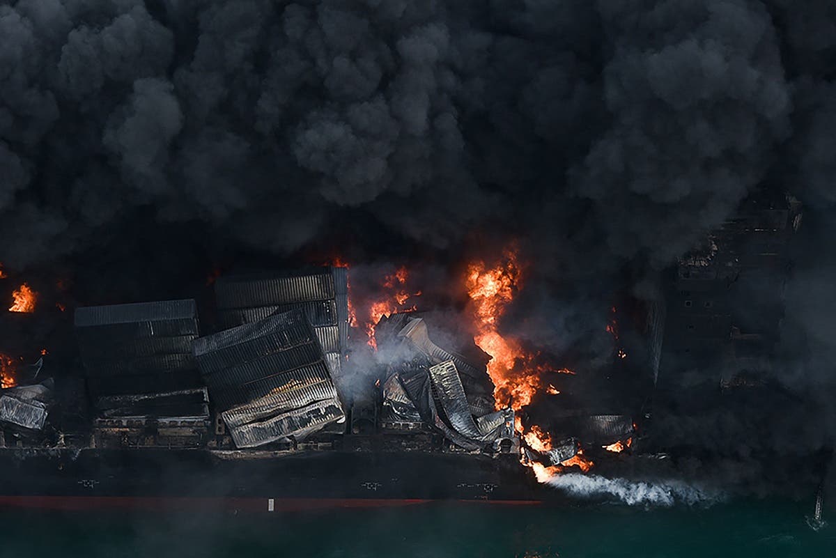 This photo released by the Sri Lanka Air Force on May 26, 2021 shows flames and thick smoke billowing from the Singapore-registered container ship MV X-Press Pearl in the sea off Sri Lanka's Colombo Harbour. (AFP)