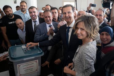 Syrian President Bashar Assad and his wife Asma vote at a polling station during the Presidential elections in the town of Douma, near the Syrian capital Damascus, Syria, May 26, 2021. (AP)