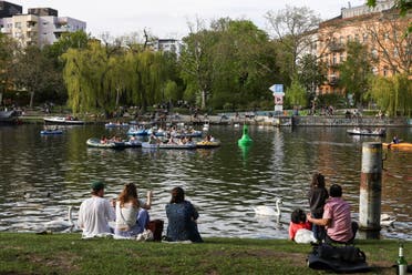 People enjoy the sunny weather on the Landwehrkanal, as the spread of the coronavirus disease (COVID-19) continues, in Berlin, Germany, May 9, 2021. (Reuters)