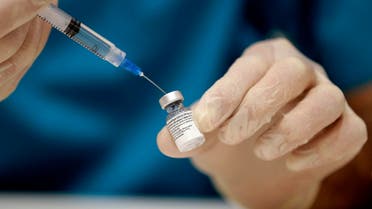 A medic prepares a dose of the COVID-19 Pfizer/BioNTech vaccine at Lebanon's American University Medical Center in the capital Beirut, on February 14, 2021, as the country kickstarts its inoculation campaign. (AFP)