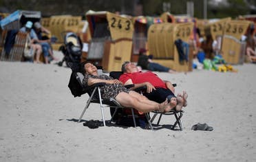 People enjoy sunbathing amid the coronavirus disease (COVID-19) pandemic at the Baltic Sea resort Eckernfoerde, Germany May 9, 2021. (Reuters)