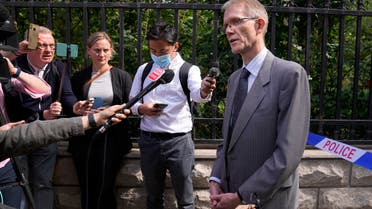 Australian ambassador to China Graham Fletcher, right, speaks to reporters near a barricade tape outside the No. 2 Intermediate People's Court after he was denied to attend the espionage charges case for Yang Hengjun, in Beijing, Thursday, May 27, 2021. (AP)